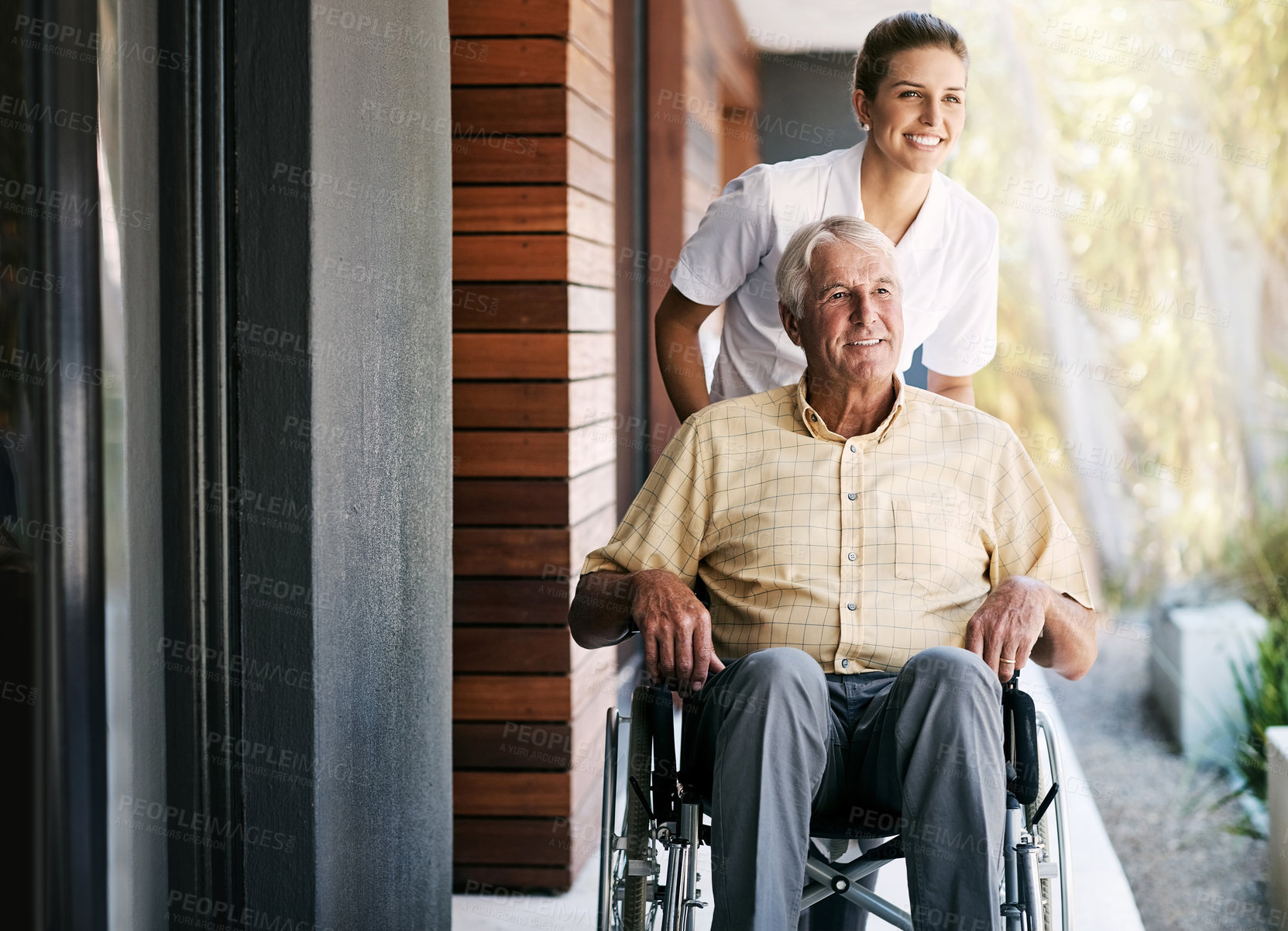 Buy stock photo Shot of a nurse caring for a senior patient in a wheelchair outside a retirement home