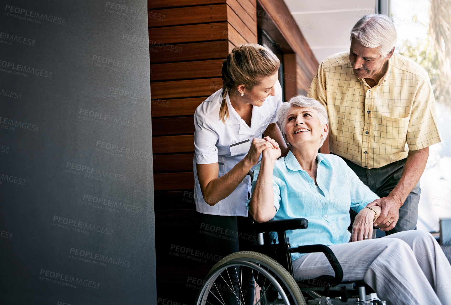 Buy stock photo Shot of a senior couple and a nurse outside a retirement home