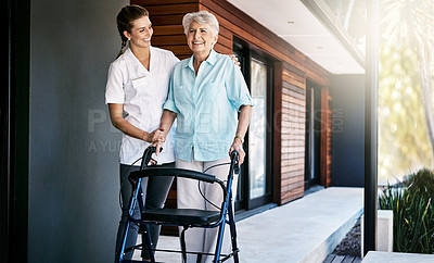 Buy stock photo Shot of a nurse assisting a senior patient outside a retirement home