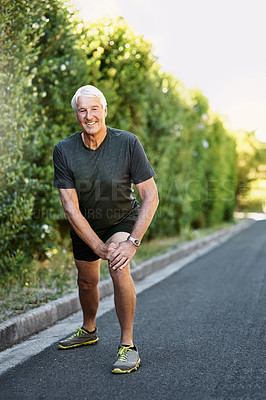 Buy stock photo Portrait, senior man and stretching legs for fitness ready for workout, exercise or training in nature. Elderly person, warm up and prepare for physical activity, running or cardio with smile outdoor