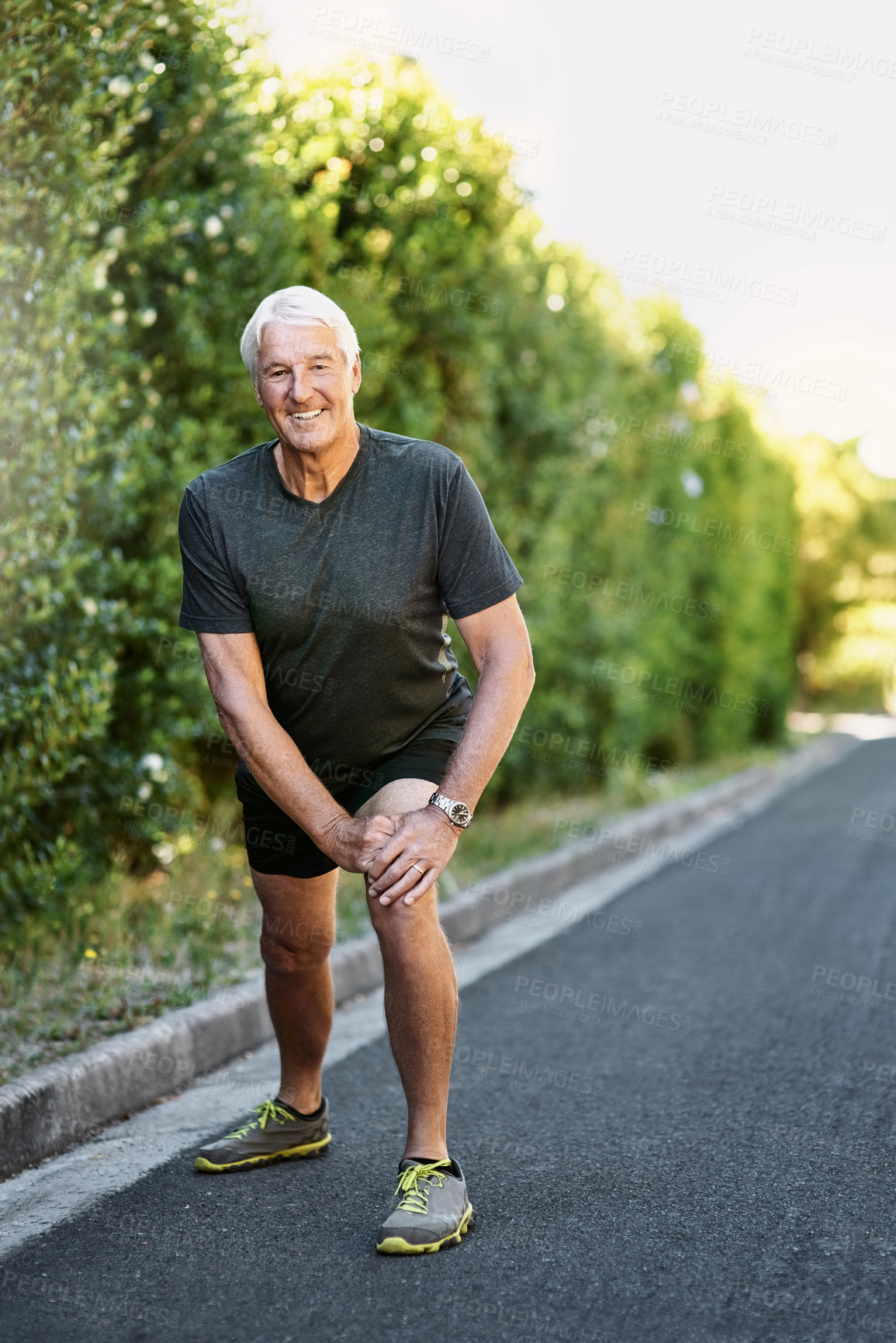 Buy stock photo Portrait, senior man and stretching legs for fitness ready for workout, exercise or training in nature. Elderly person, warm up and prepare for physical activity, running or cardio with smile outdoor