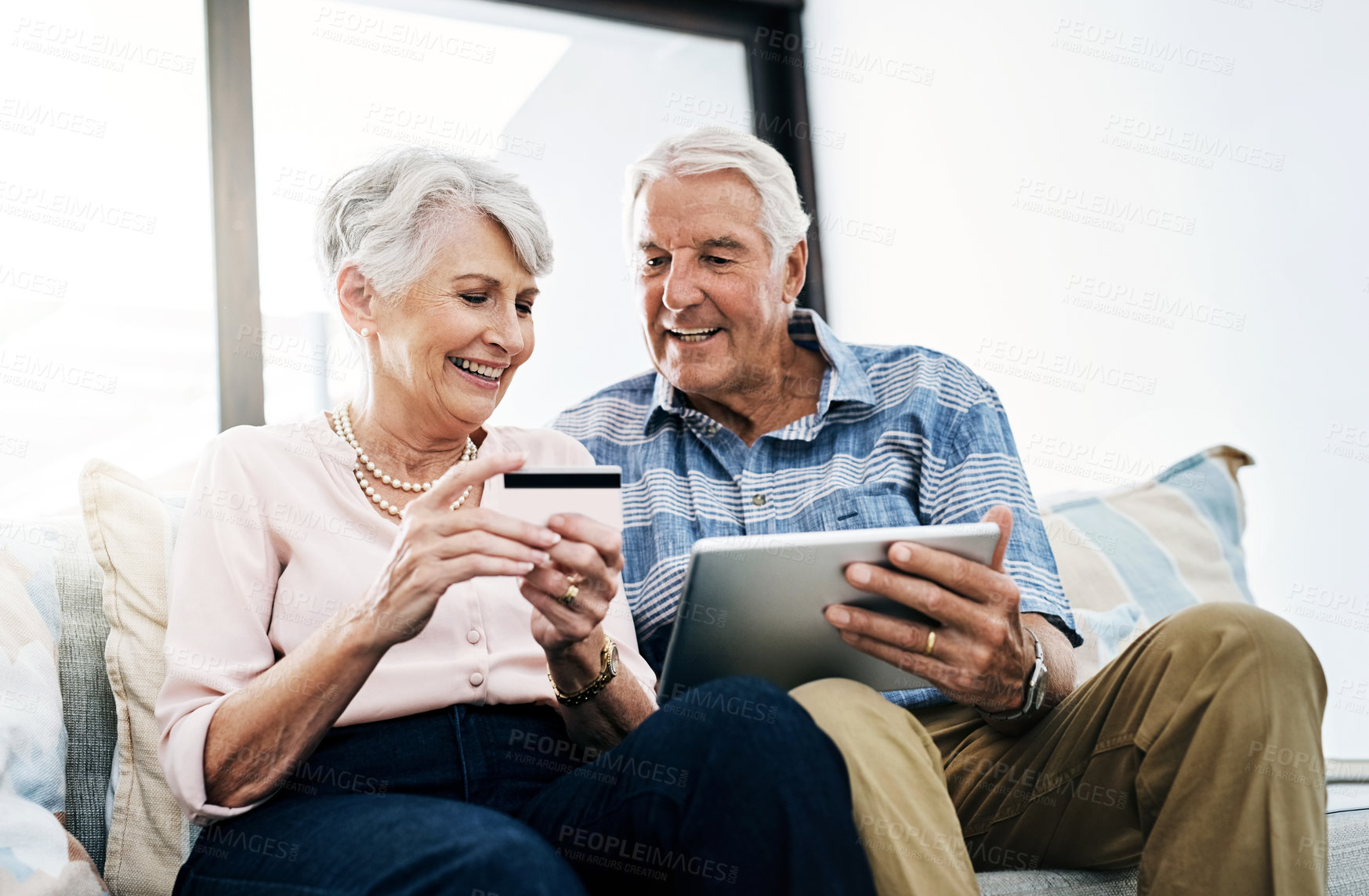 Buy stock photo Senior couple, home and tablet with credit card on sofa for online shopping, payment and retirement plan. People, happy and couch at living room for internet banking, budget and investment or finance