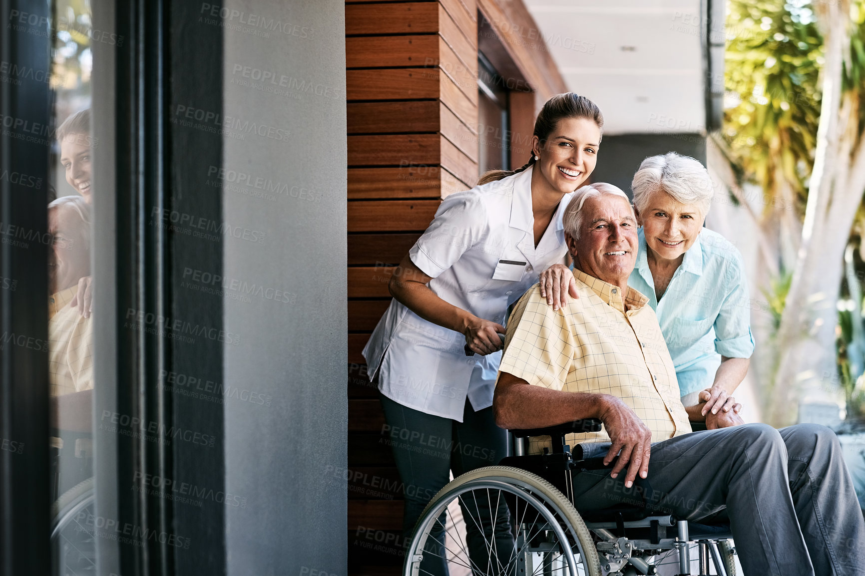 Buy stock photo Senior, couple and nurse outdoor wheelchair, happiness or portrait healthcare service at nursing home. Woman, medic and man with disability injury for therapy, healing and support on retirement