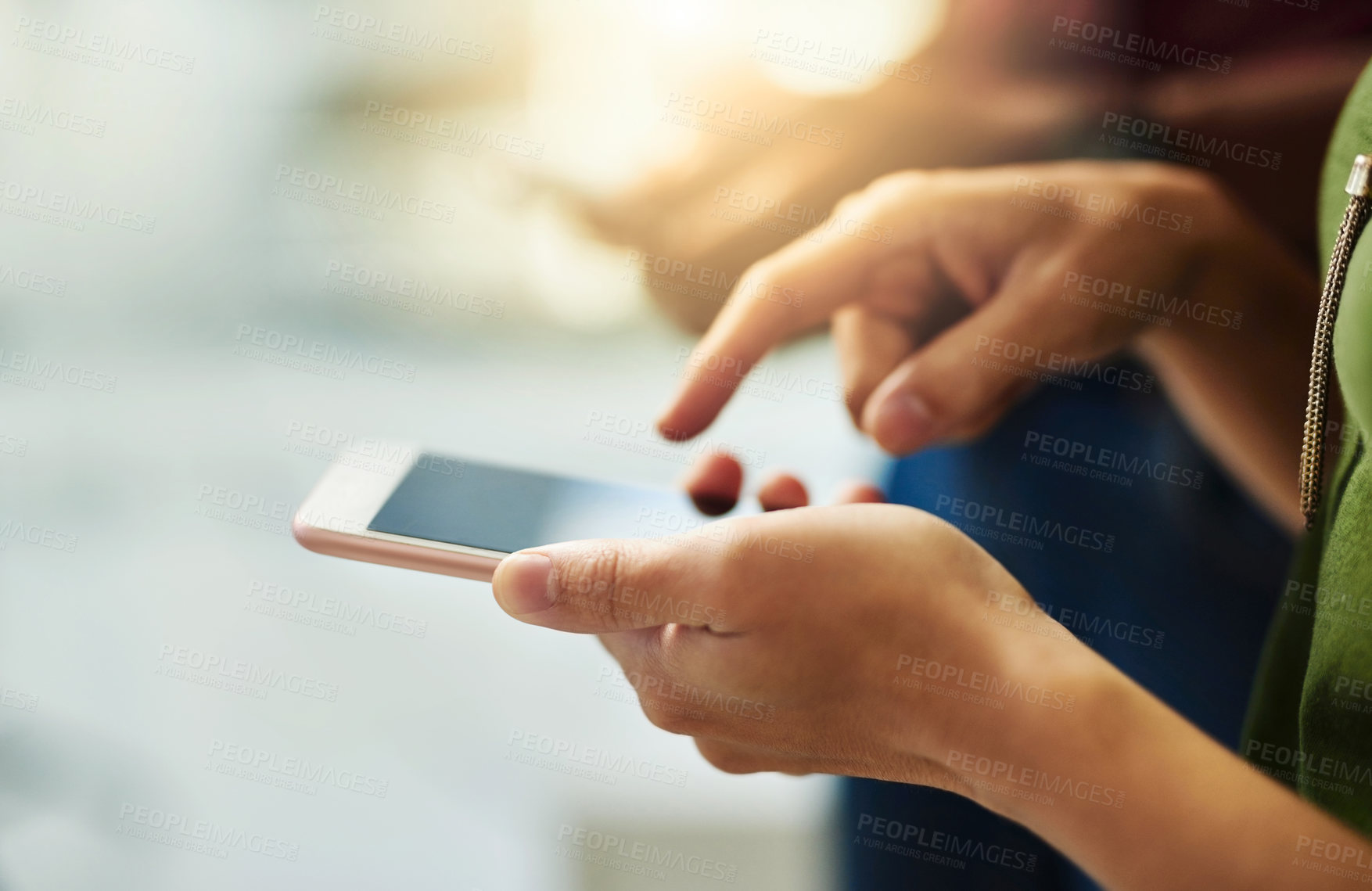 Buy stock photo Closeup of hands of a corporate business person typing on a phone while standing in an office. Top view of a professional scrolling through social media, checking and reading texts and sending emails