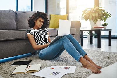 Buy stock photo Shot of a young woman working from home