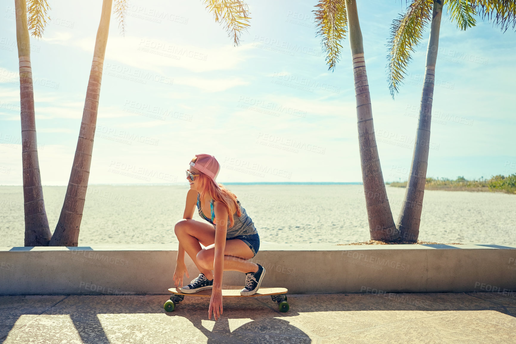 Buy stock photo Skateboarder, summer and woman on boardwalk for holiday, weekend break and travel trip for activity. Outdoor, vacation and happy person with sunglasses on promenade, tourism and sport hobby in Miami