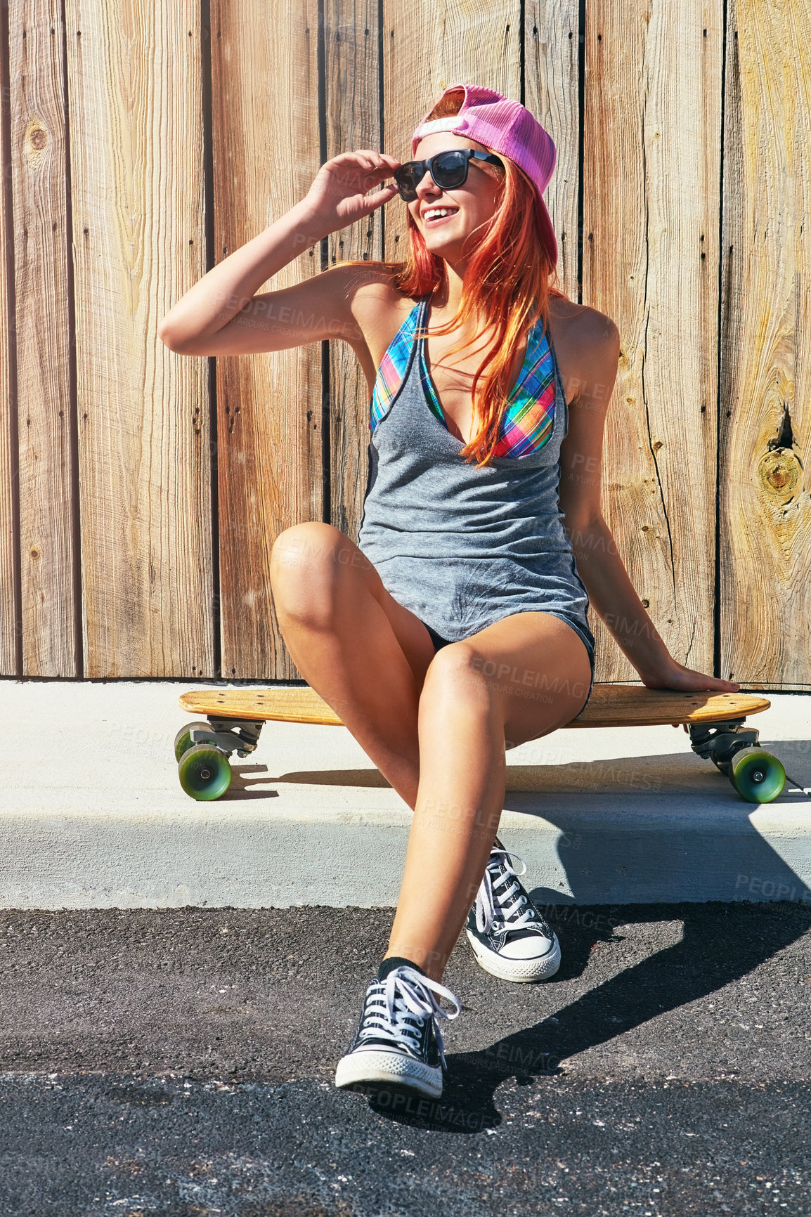 Buy stock photo Thinking, skateboard or woman on sidewalk for holiday, sunglasses or weekend break for reflection. Outdoor perspective, smile or person with skating gear for hobby, shades or idea for summer vacation