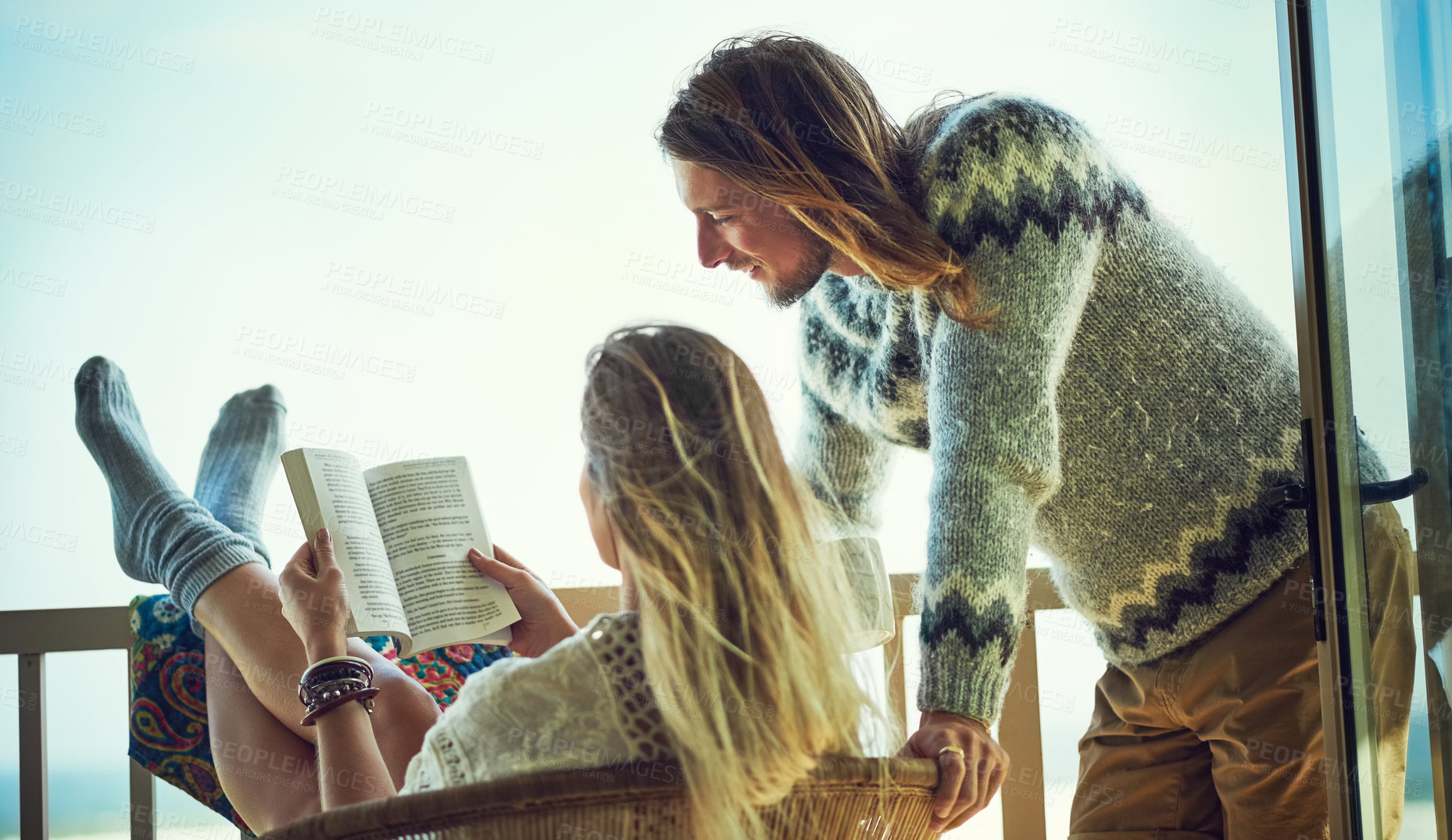 Buy stock photo Couple, relax and reading book on balcony outdoor with love, calm morning and holiday hobby. Space, people and terrace for fresh air, literature novel and bonding together on patio at vacation house