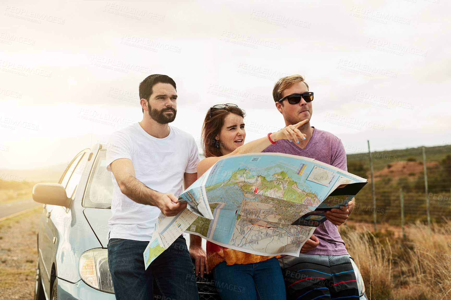 Buy stock photo Group, reading map and travel on road trip, vacation and planning holiday for navigation by car transport. Friends, people and direction guide for journey, adventure and pointing to location outdoor