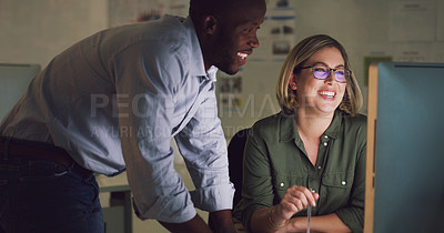 Buy stock photo Cropped shot of two businesspeople working together on a computer in their office