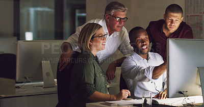 Buy stock photo Cropped shot of a group of businesspeople working together on a computer in their office