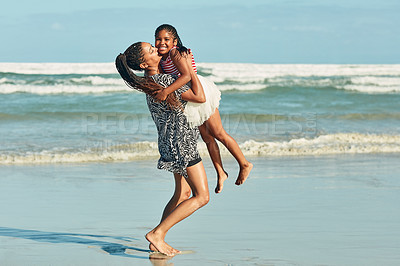 Buy stock photo Portrait of a little girl bonding with her mother at the beach