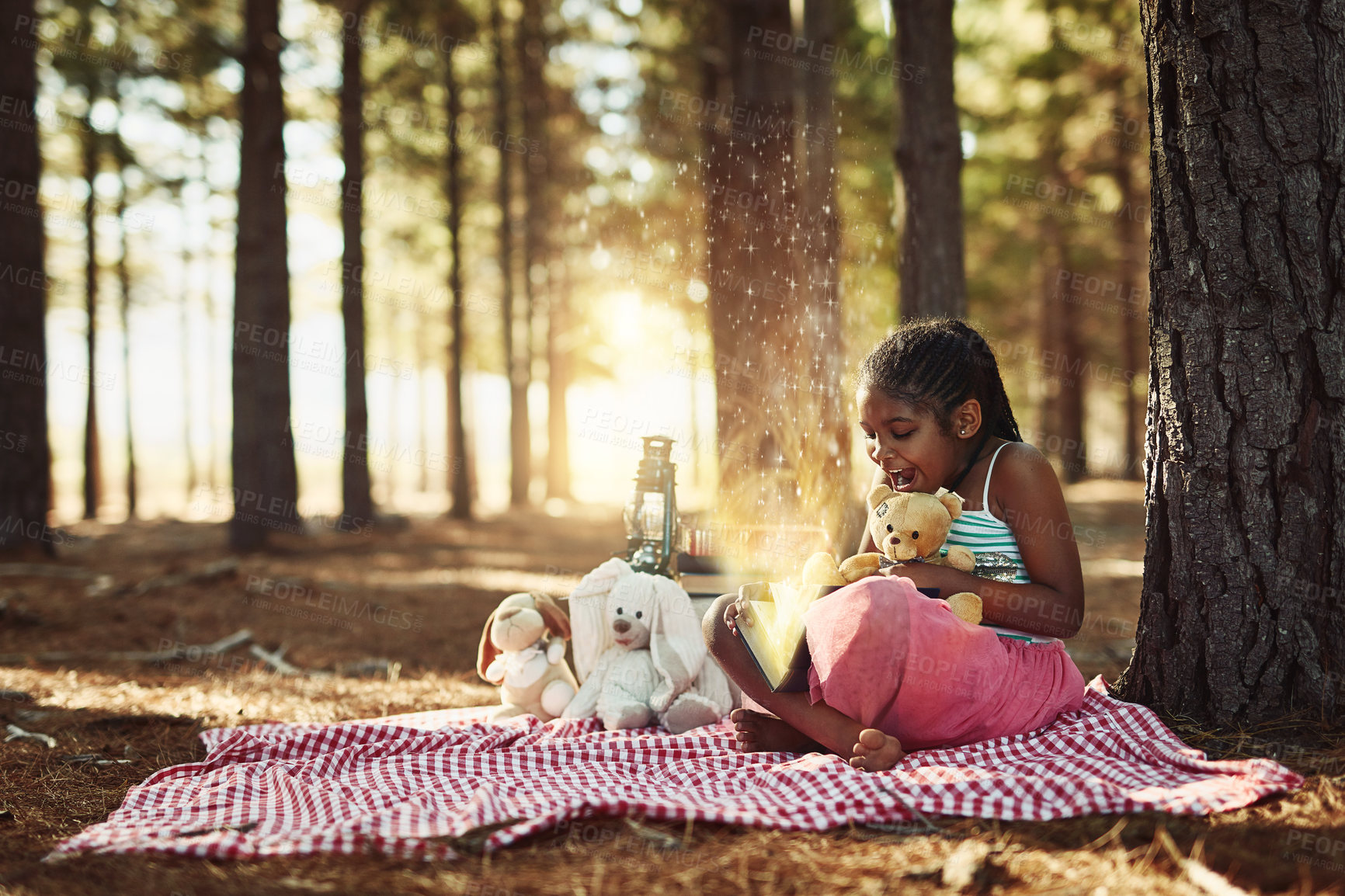 Buy stock photo Book, fantasy and picnic with black girl in forest, reading literature outdoor for education or hobby. Magic, overlay and storytelling with happy child in nature or woods for break or leisure