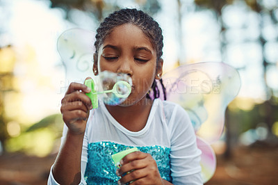 Buy stock photo Forest, princess costume and girl with bubbles for playing fantasy, childhood games and happiness. Nature, fairy tale and face of happy child in woods blowing bubble for adventure, magic and fun