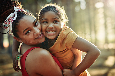 Buy stock photo Shot of a mother and her little daughter bonding in the woods