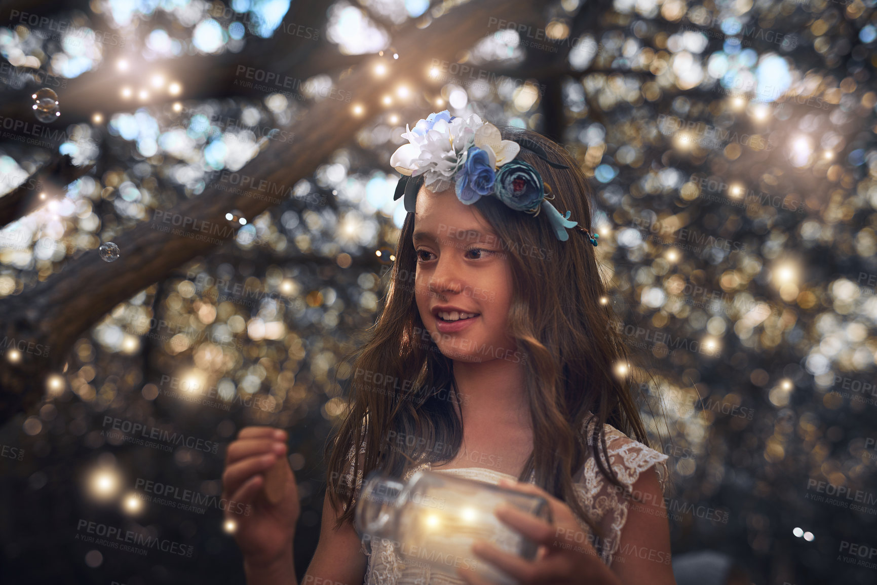Buy stock photo Shot of a little girl catching fireflies in a jar outside