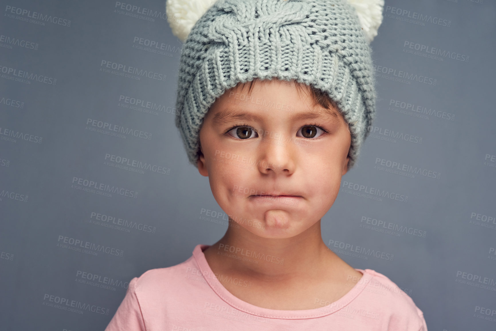 Buy stock photo Studio portrait of an adorable little boy posing against a gray background