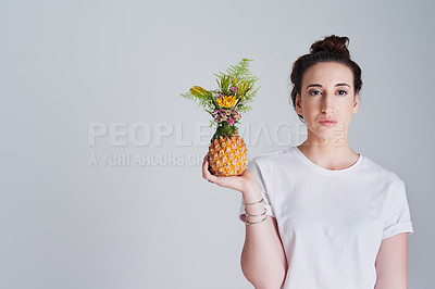 Buy stock photo Woman, portrait and pineapple for health in studio with tropical fruit, mockup space and detox of wellness. Nutritionist, organic ananas and flowers growth for nutrition balance on white background