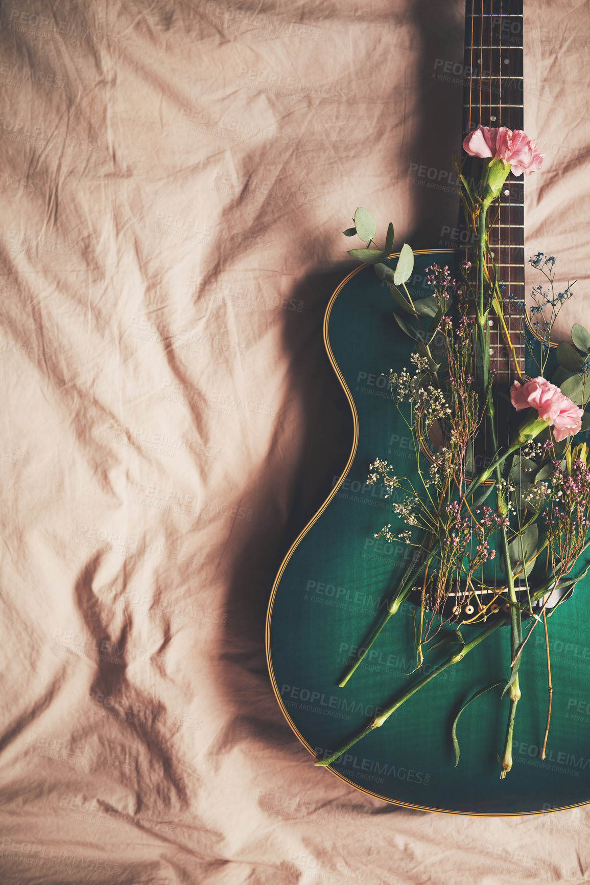 Buy stock photo Bed, instrument and guitar with flowers in home, green and creative with nature in bedroom and above. Art, music and equipment with plants in house, floral and entertainment for performance or talent