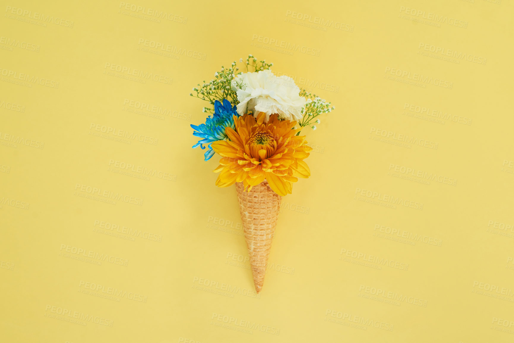 Buy stock photo Floral ice cream in a cone in a studio for art, creativity or decoration with fresh and colorful bouquet. Creative, still life and blossom flowers or plants in a dessert isolated by yellow background