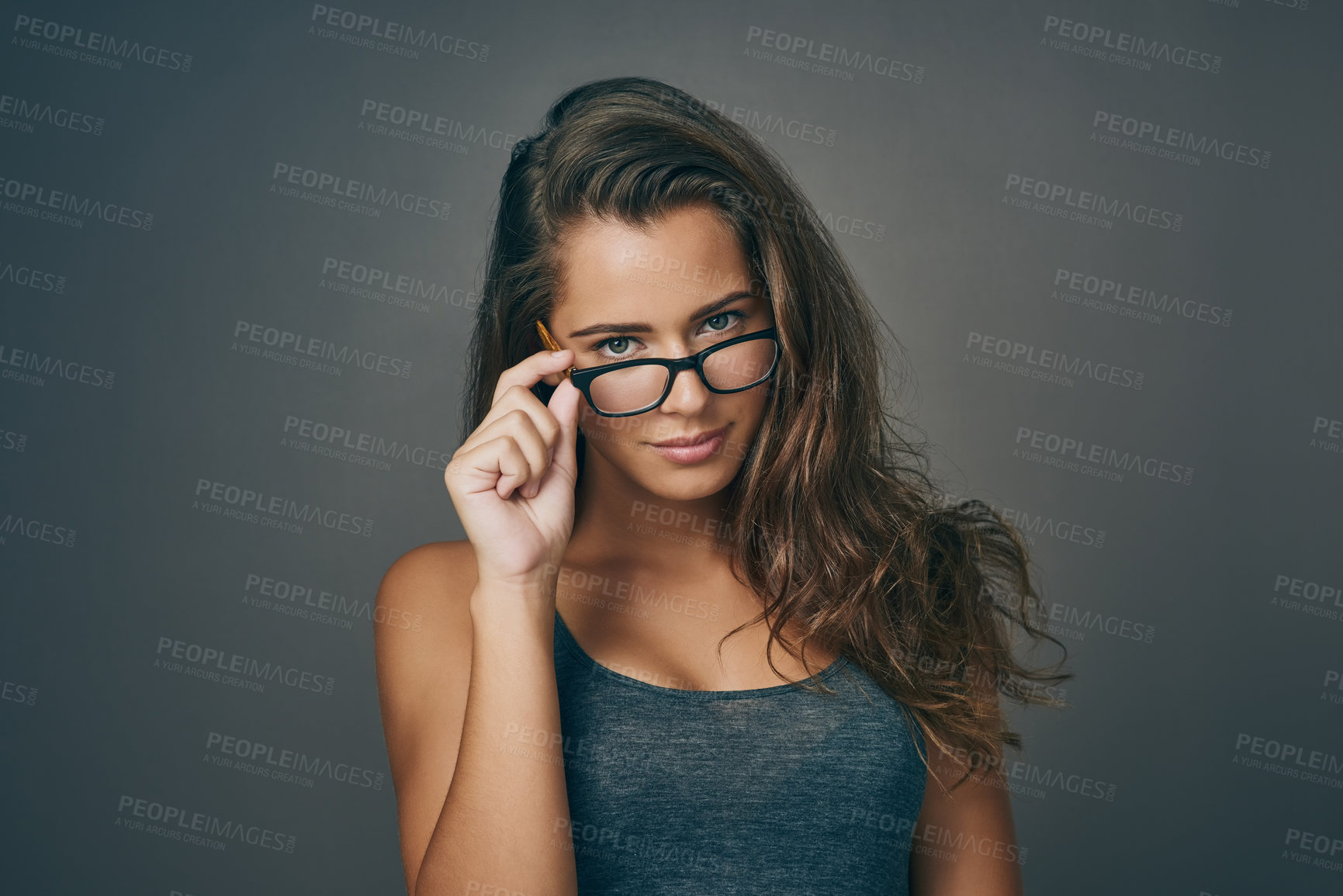 Buy stock photo Woman, portrait and confident with eyeglasses in studio on grey background for prescription, eyewear and eyesight. Female person, satisfied and serious with frame for spectacles, lens and vision