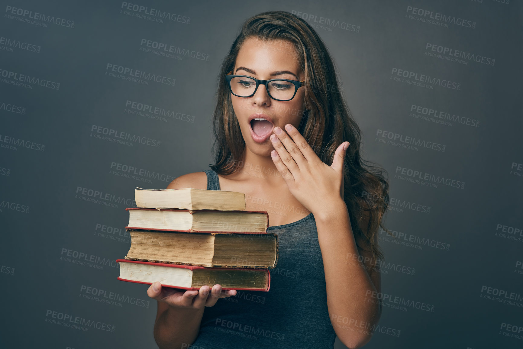 Buy stock photo Studying, surprise and books for reading with woman with university, college and library textbook in studio. Wow, knowledge and learning shock of student with education, exam and dark background