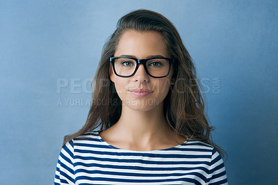 Buy stock photo Studio shot of an attractive young woman wearing glasses