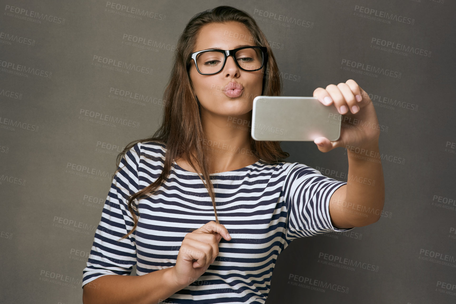 Buy stock photo Girl, confident and selfie with glasses in studio for social media post, eyewear update and prescription for vision. Woman, photography and gray background with spectacles for eye care and optometry.