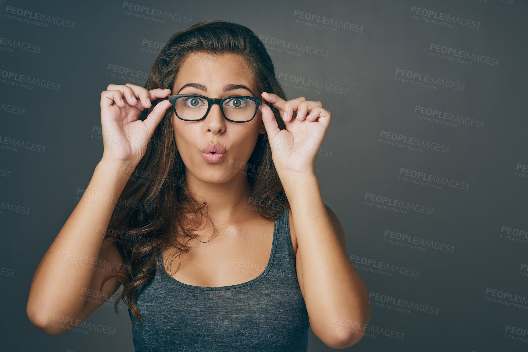 Buy stock photo Portrait, woman and shocked with glasses in studio for space, eye care and lens vision of prescription frame. Girl, surprise and eyewear discount for consultation, ophthalmology and grey background