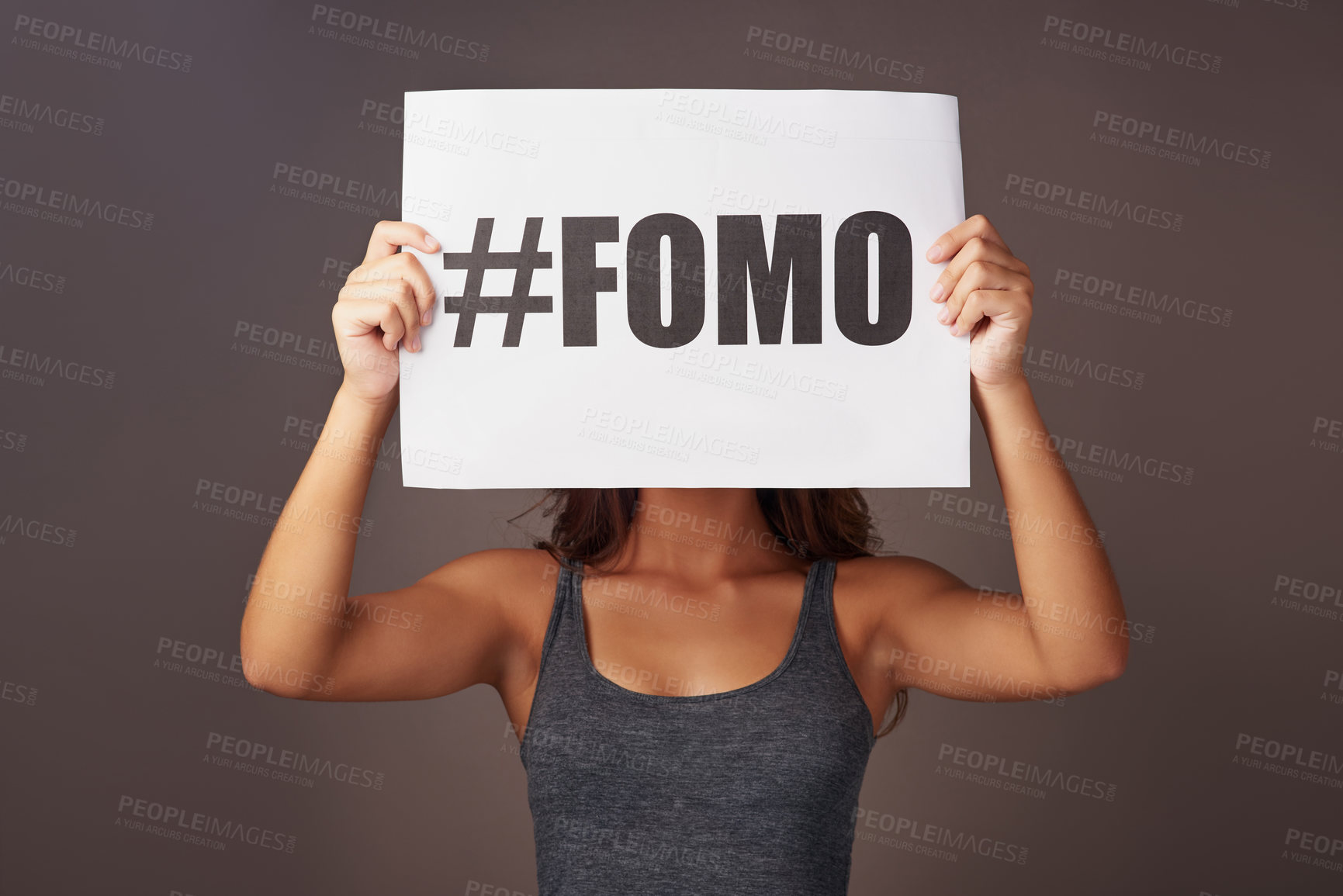 Buy stock photo Poster, sign and hands of woman in studio with text, information and advertising of insecurity. Paper, announcement and female person with anxiety on gray background for fomo, crisis and awareness