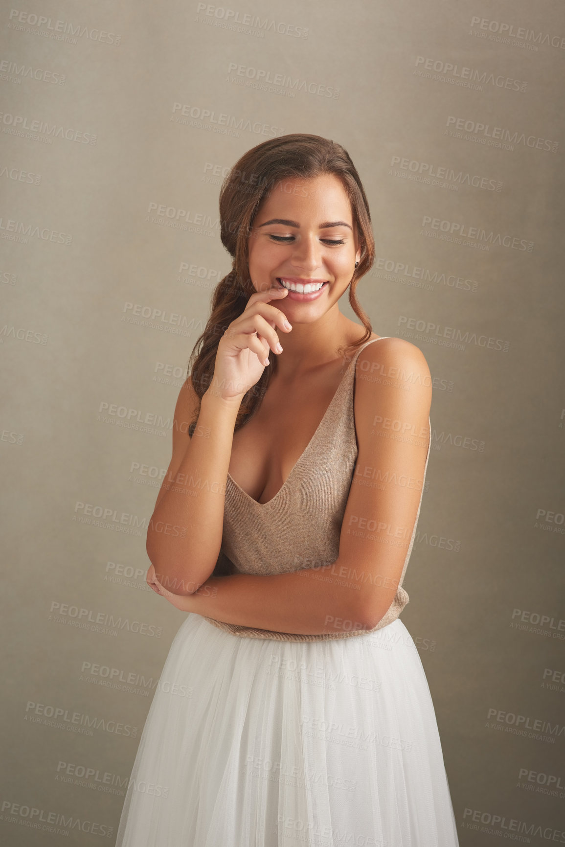 Buy stock photo Woman, happy and shy on studio background for fashion, aesthetic and cute outfit with stylish skirt. Female person, nervous and smile for cool, trendy and luxury or designer clothes as feminine lady