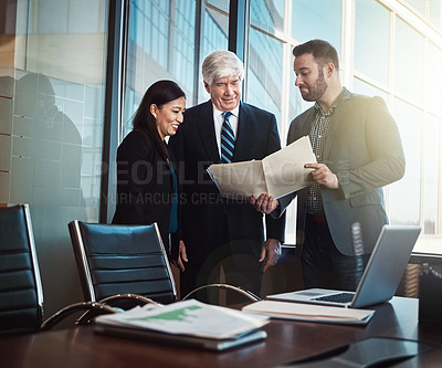 Buy stock photo Business man, woman and paperwork in boardroom with discussion, computer and reading at financial agency. People, team and group with documents for stats, feedback and collaboration in modern office