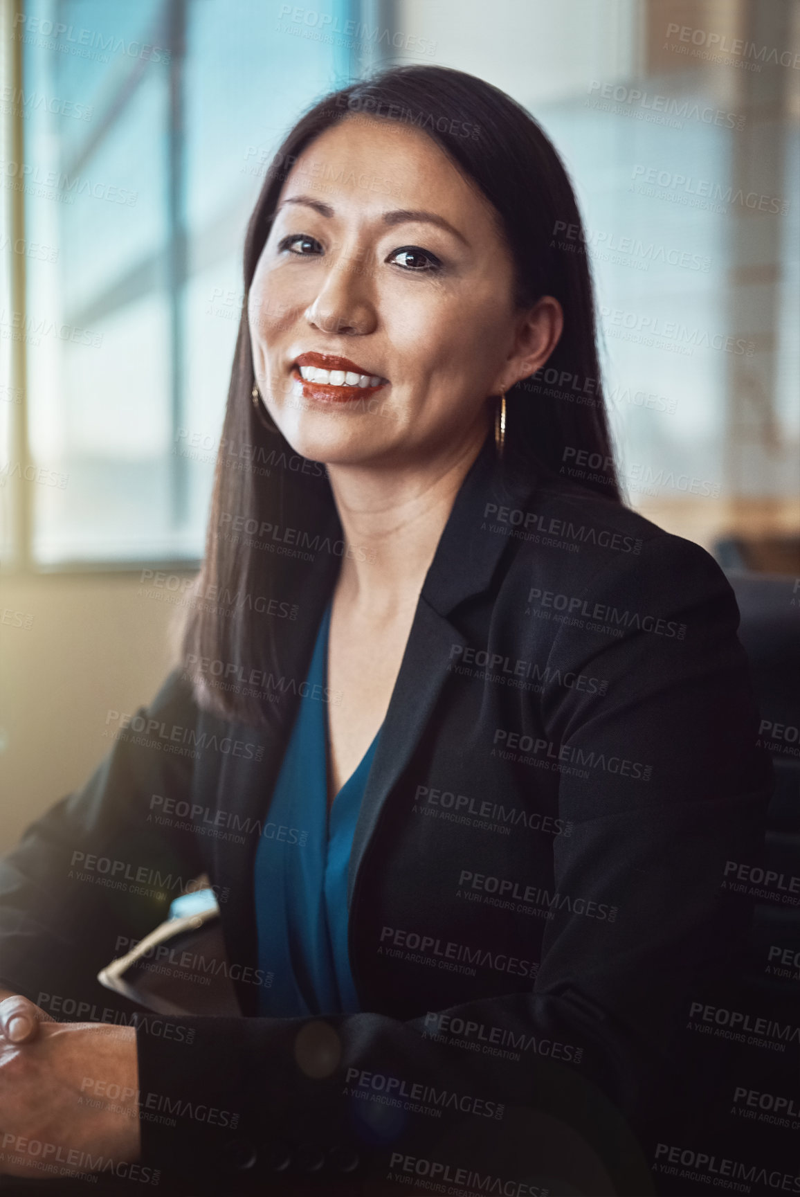 Buy stock photo Cropped portrait of a mature businesswoman sitting in her office