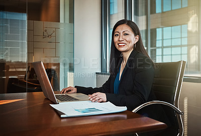 Buy stock photo Cropped portrait of a mature businesswoman working on her laptop in the office