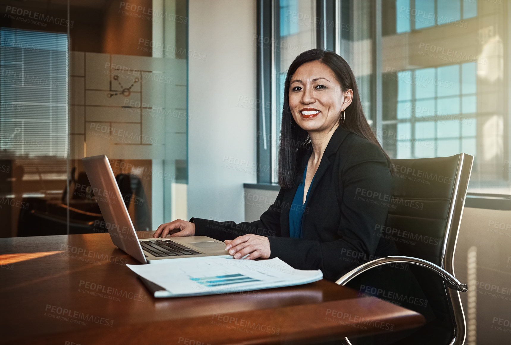 Buy stock photo Cropped portrait of a mature businesswoman working on her laptop in the office