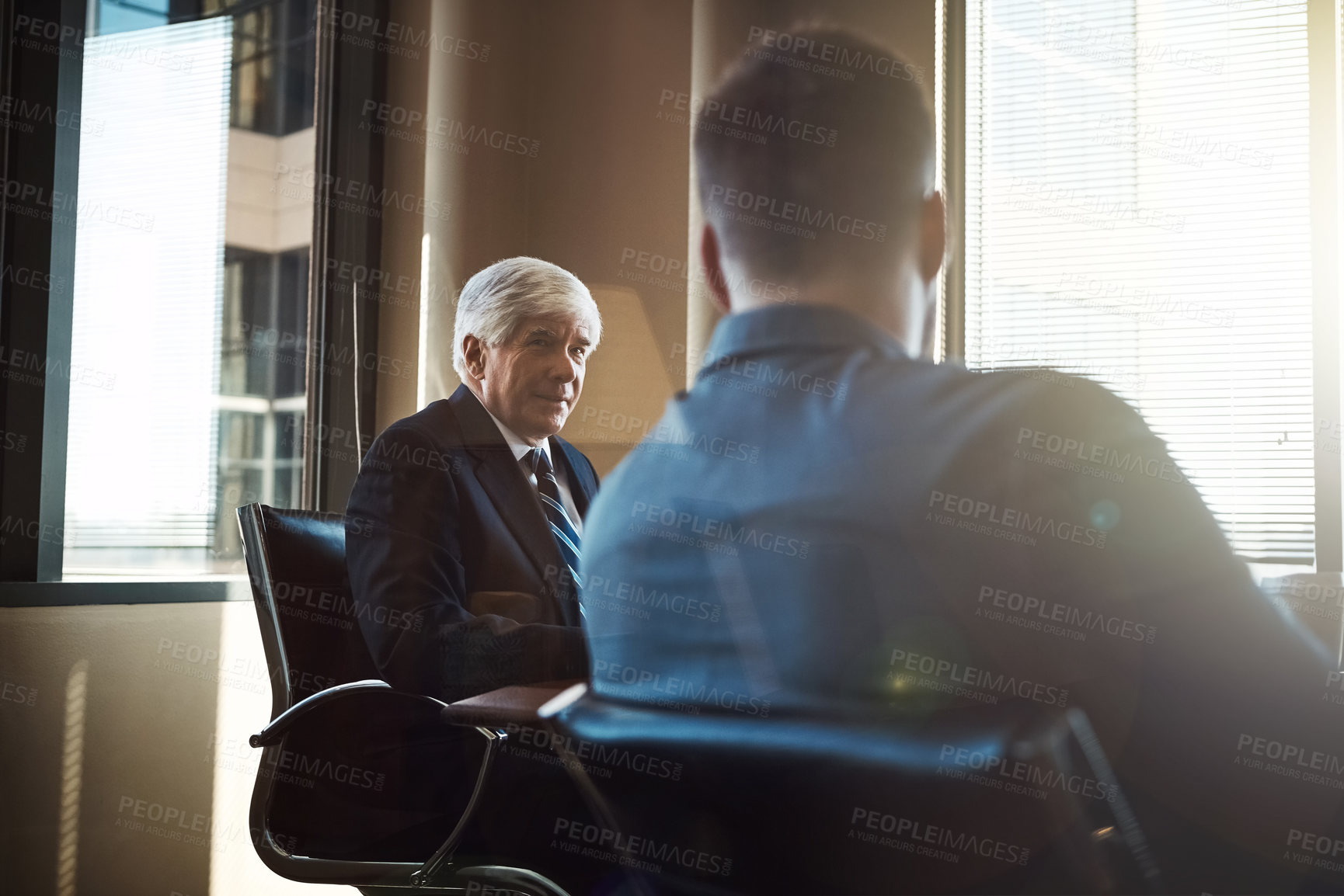 Buy stock photo Cropped shot of two businessmen working together in the boardroom