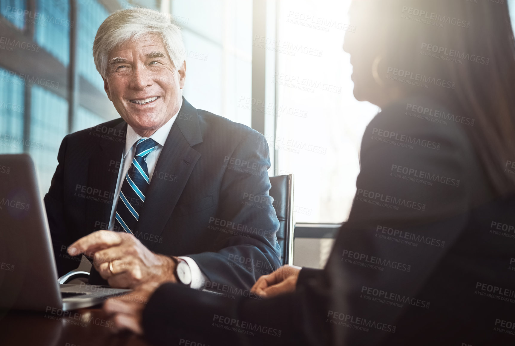 Buy stock photo Cropped shot of two businesspeople working together in the boardroom