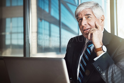 Buy stock photo Cropped shot of a mature businessman looking pensive while working in his office