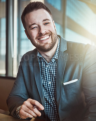 Buy stock photo Cropped portrait of a young businessman working in his office