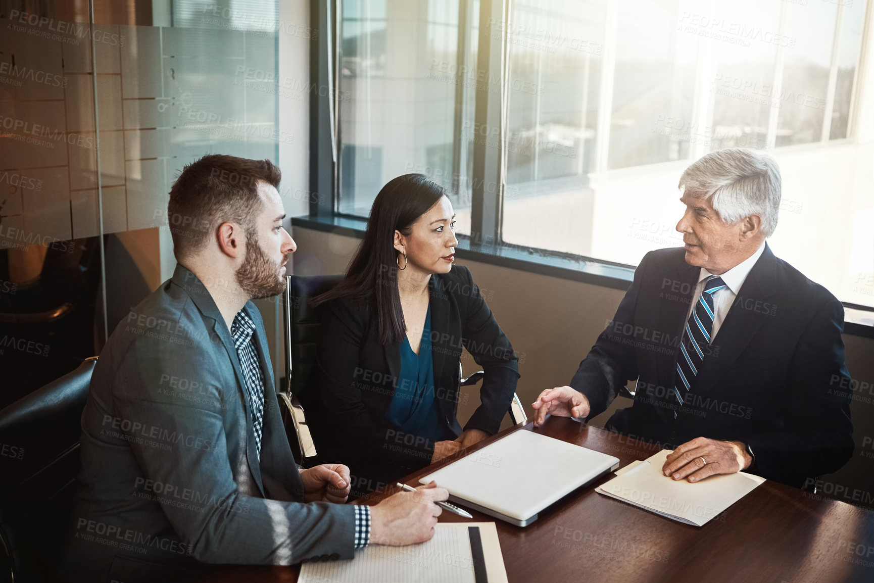 Buy stock photo Men, woman and lawyer with documents in boardroom for discussion, negotiation and legal compliance. People, business owner and attorney with paperwork, laptop and listen to advice for company growth