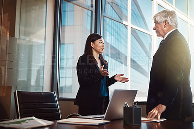 Buy stock photo Business man, woman and discussion in boardroom with documents, computer or feedback at financial agency. People, risk analyst and senior manager with talk, question or collaboration in modern office