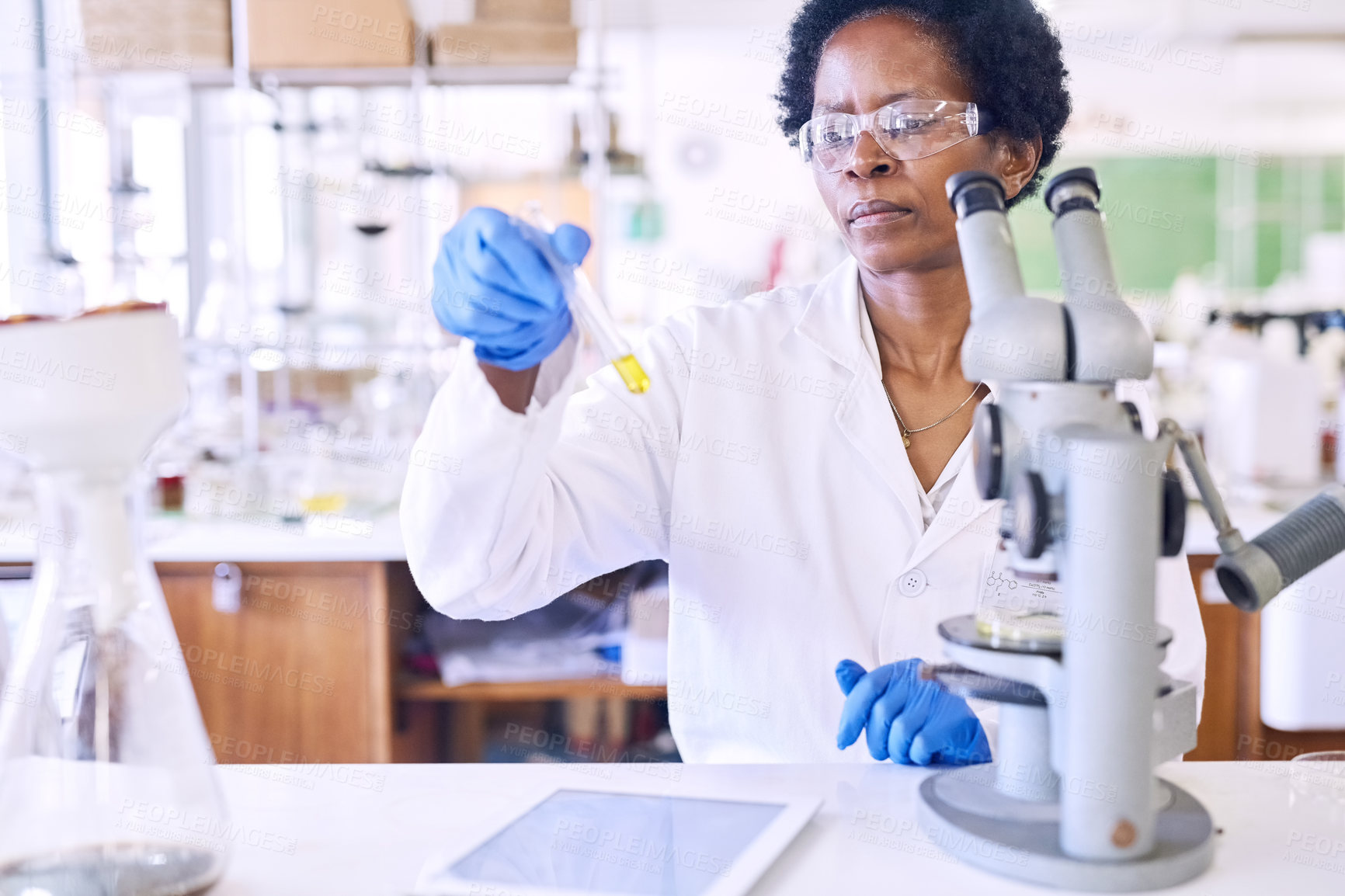 Buy stock photo Shot of a female scientist working in a lab