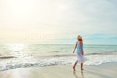 Buy stock photo Shot an attractive young woman enjoying a day at the beach