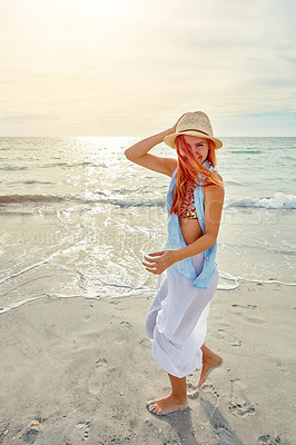 Buy stock photo Portrait an attractive young woman enjoying a day at the beach