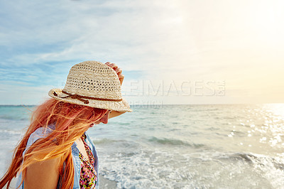 Buy stock photo Shot an attractive young woman enjoying a day at the beach