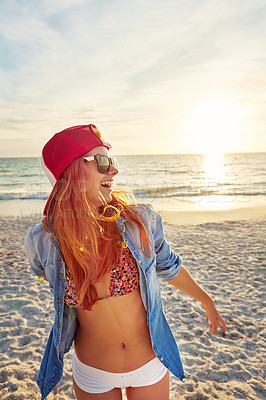 Buy stock photo Shot an attractive young woman enjoying a day at the beach