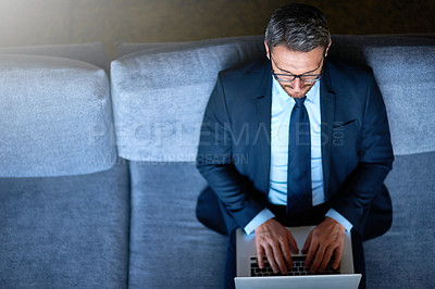 Buy stock photo Sofa, laptop and above of business man for commute, travel and journey for work trip or conference. Corporate, premium lounge and person on computer in lobby for website, flight schedule and internet