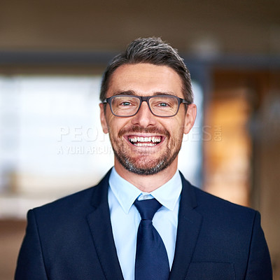 Buy stock photo Portrait of a confident businessman smiling while standing in his office