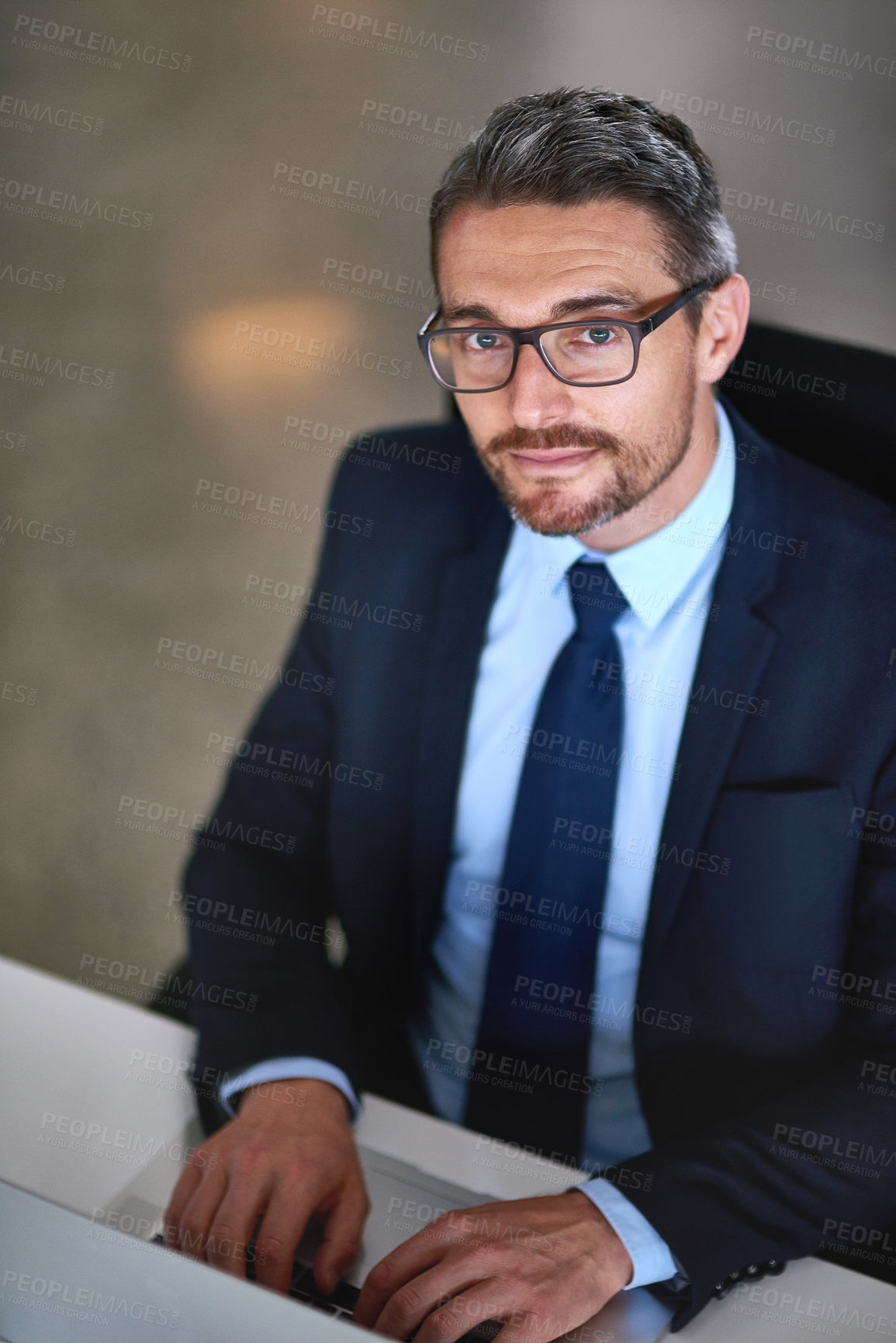 Buy stock photo Portrait, laptop and businessman typing at desk with research, legal advice and networking at law firm. Lawyer, attorney or mature man with computer, writing email and consulting for online feedback.