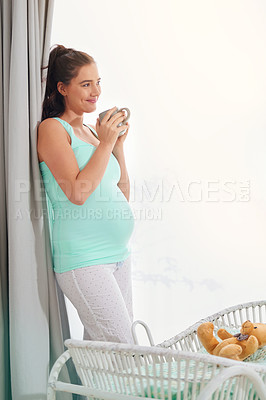Buy stock photo Cropped shot of an attractive young pregnant woman standing in her baby's room